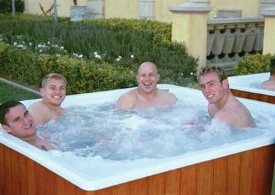 men enjoying a jacuzzi bath
